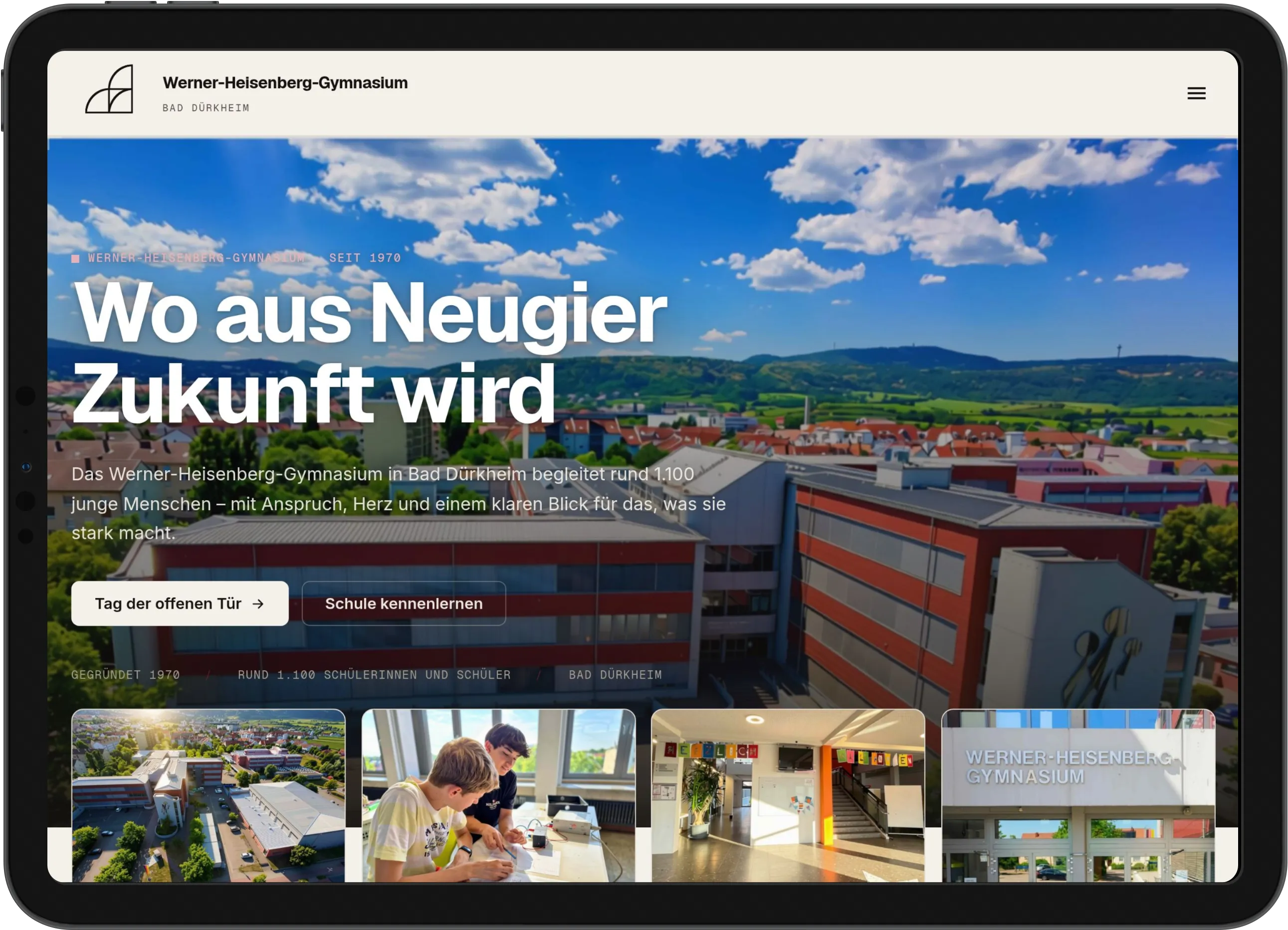 Tablet im Querformat mit der Startseite des Werner-Heisenberg-Gymnasiums