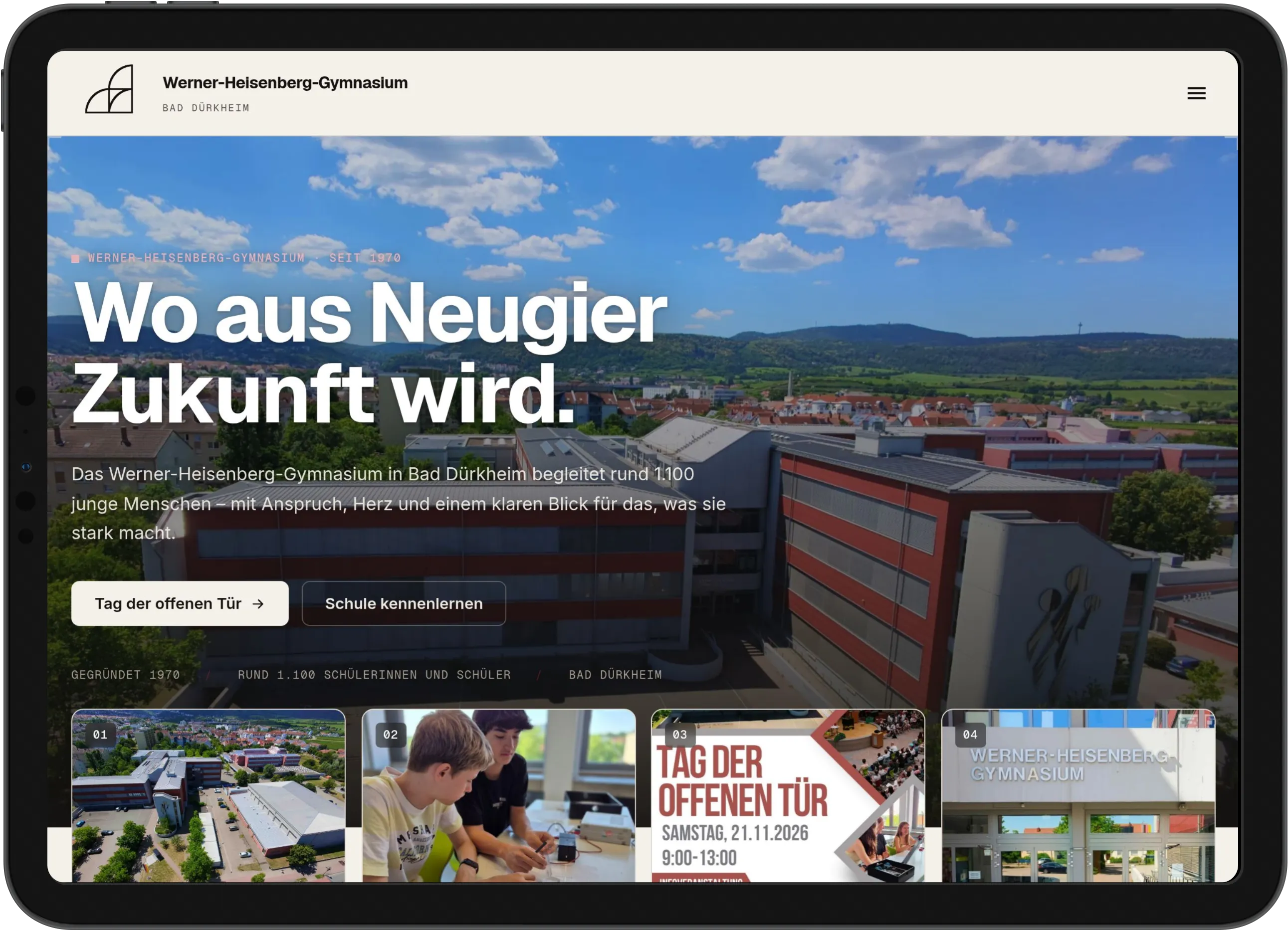 Tablet im Querformat mit der Startseite des Werner-Heisenberg-Gymnasiums